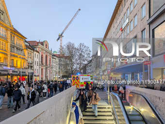 In Munich, Germany, on December 28, 2024, a Johanniter rescue vehicle with flashing blue lights parks on the shopping street Kaufinger Stras...