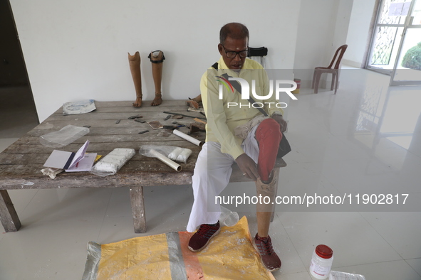 A man waits for his new prosthetic limb inside the Rehabilitation & Research Centre, a unit of Mahavir Seva Sadan, in Arambag on the outskir...