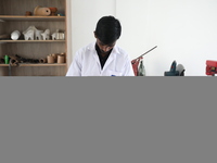 A worker measures a limb prosthetic inside the Rehabilitation & Research Centre, a unit of Mahavir Seva Sadan, in Arambag on the outskirts o...