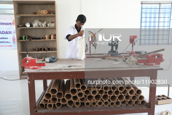 A worker manufactures a prosthetic limb inside the Rehabilitation & Research Centre, a unit of Mahavir Seva Sadan, in Arambag on the outskir...