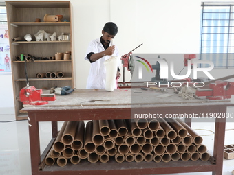 A worker manufactures a prosthetic limb inside the Rehabilitation & Research Centre, a unit of Mahavir Seva Sadan, in Arambag on the outskir...