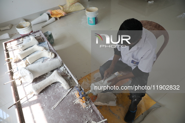 A worker manufactures a prosthetic limb inside the Rehabilitation & Research Centre, a unit of Mahavir Seva Sadan, in Arambag on the outskir...