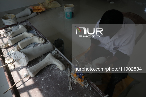 A worker manufactures a prosthetic limb inside the Rehabilitation & Research Centre, a unit of Mahavir Seva Sadan, in Arambag on the outskir...