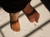 An amputee woman stands with her new prosthetic limb inside the Rehabilitation & Research Centre, a unit of Mahavir Seva Sadan, in Arambag o...