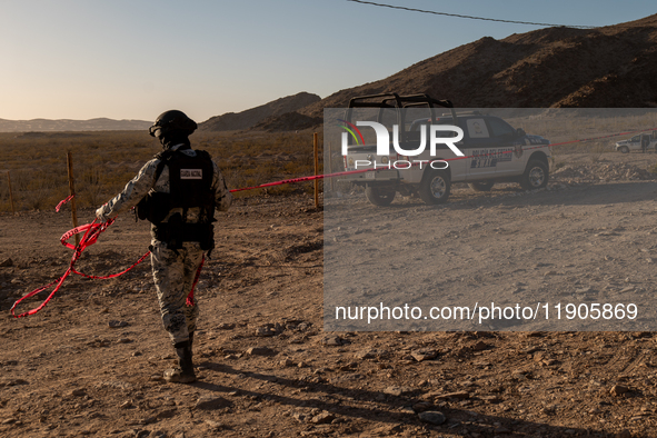 Members of the National Guard secure the area near the site where an immigration officer loses his life after being attacked with rocks thro...