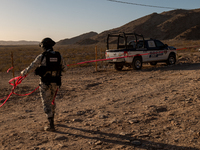 Members of the National Guard secure the area near the site where an immigration officer loses his life after being attacked with rocks thro...