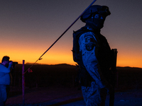 A photographer documents the area near the site where a Mexican immigration officer loses his life after being struck by rocks thrown by mig...