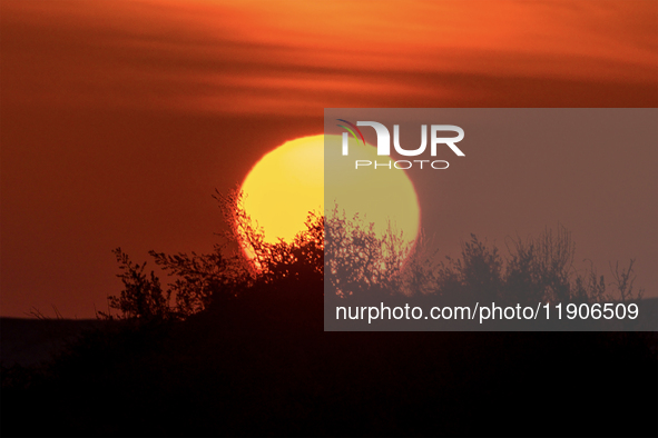 Sealine Sand Dunes stand against the backdrop of the last sunset of the year 2024 in Sealine, Qatar, on December 31, 2024. The Sealine Deser...