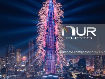 A light show and fireworks illuminate the Burj Khalifa, the world's tallest building, during New Year's Eve celebrations in Dubai on January...