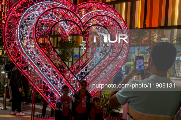 People take pictures at Lusail Boulevard during the 2025 New Year's Day celebrations in Doha, Qatar, on January 1, 2025. 