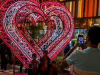 People take pictures at Lusail Boulevard during the 2025 New Year's Day celebrations in Doha, Qatar, on January 1, 2025. (