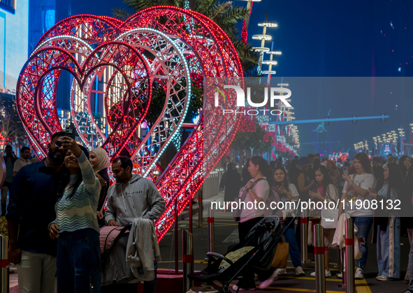 People take pictures at Lusail Boulevard during the 2025 New Year's Day celebrations in Doha, Qatar, on January 1, 2025. 