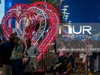 People take pictures at Lusail Boulevard during the 2025 New Year's Day celebrations in Doha, Qatar, on January 1, 2025. (