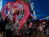 People take pictures at Lusail Boulevard during the 2025 New Year's Day celebrations in Doha, Qatar, on January 1, 2025. (