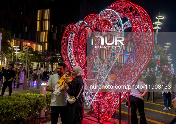 People take pictures at Lusail Boulevard during the 2025 New Year's Day celebrations in Doha, Qatar, on January 1, 2025. 