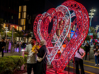 People take pictures at Lusail Boulevard during the 2025 New Year's Day celebrations in Doha, Qatar, on January 1, 2025. (