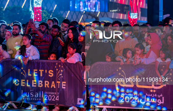 People gather at Lusail Boulevard during New Year's Day celebrations in Doha, Qatar, on January 1, 2025. 