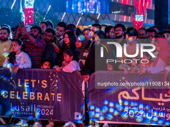 People gather at Lusail Boulevard during New Year's Day celebrations in Doha, Qatar, on January 1, 2025. (