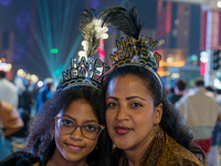 Women wear New Year headbands during New Year's Day celebrations at Lusail Boulevard in Doha, Qatar, on January 1, 2025. (