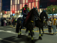 Police on horses patrol as people gather for 2025 New Year's Day celebrations at Lusail Boulevard in Doha, Qatar, on January 1, 2025. (