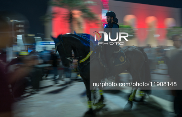 Police on horses patrol as people gather for 2025 New Year's Day celebrations at Lusail Boulevard in Doha, Qatar, on January 1, 2025. 