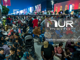 People gather at Lusail Boulevard during New Year's Day celebrations in Doha, Qatar, on January 1, 2025. (