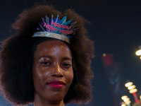 A woman wears a New Year's headband during New Year's Day celebrations at Lusail Boulevard in Doha, Qatar, on January 1, 2025. (