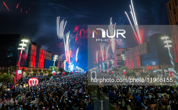 Fireworks and a drone show light up the midnight sky over Lusail Boulevard during the 2025 New Year's Day celebrations in Doha, Qatar, on Ja...