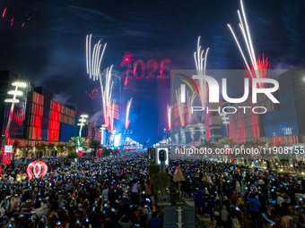 Fireworks and a drone show light up the midnight sky over Lusail Boulevard during the 2025 New Year's Day celebrations in Doha, Qatar, on Ja...