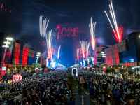 Fireworks and a drone show light up the midnight sky over Lusail Boulevard during the 2025 New Year's Day celebrations in Doha, Qatar, on Ja...