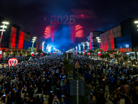 Fireworks and a drone show light up the midnight sky over Lusail Boulevard during the 2025 New Year's Day celebrations in Doha, Qatar, on Ja...