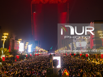 Fireworks and a drone show light up the midnight sky over Lusail Boulevard during the 2025 New Year's Day celebrations in Doha, Qatar, on Ja...