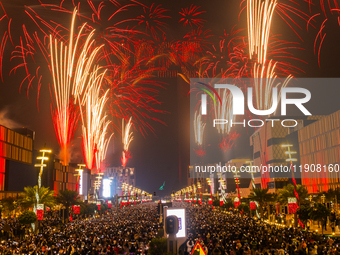 Fireworks and a drone show light up the midnight sky over Lusail Boulevard during the 2025 New Year's Day celebrations in Doha, Qatar, on Ja...