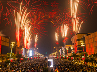 Fireworks and a drone show light up the midnight sky over Lusail Boulevard during the 2025 New Year's Day celebrations in Doha, Qatar, on Ja...