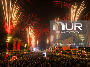 Fireworks and a drone show light up the midnight sky over Lusail Boulevard during the 2025 New Year's Day celebrations in Doha, Qatar, on Ja...