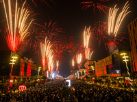 Fireworks and a drone show light up the midnight sky over Lusail Boulevard during the 2025 New Year's Day celebrations in Doha, Qatar, on Ja...