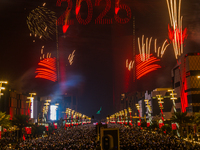 Fireworks and a drone show light up the midnight sky over Lusail Boulevard during the 2025 New Year's Day celebrations in Doha, Qatar, on Ja...