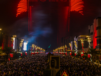 Fireworks and a drone show light up the midnight sky over Lusail Boulevard during the 2025 New Year's Day celebrations in Doha, Qatar, on Ja...