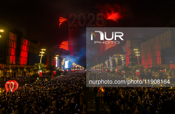 Fireworks and a drone show light up the midnight sky over Lusail Boulevard during the 2025 New Year's Day celebrations in Doha, Qatar, on Ja...