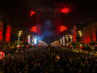 Fireworks and a drone show light up the midnight sky over Lusail Boulevard during the 2025 New Year's Day celebrations in Doha, Qatar, on Ja...