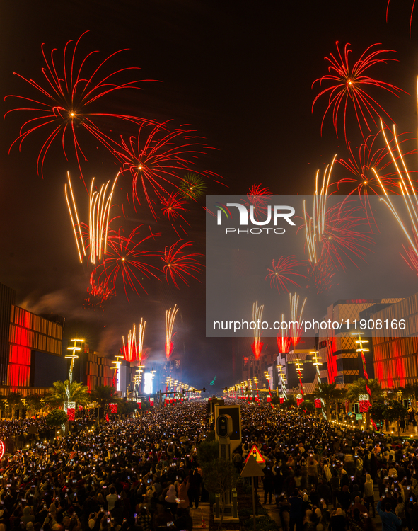 Fireworks and a drone show light up the midnight sky over Lusail Boulevard during the 2025 New Year's Day celebrations in Doha, Qatar, on Ja...