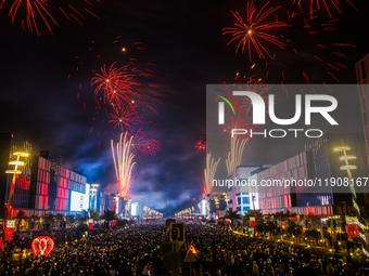 Fireworks and a drone show light up the midnight sky over Lusail Boulevard during the 2025 New Year's Day celebrations in Doha, Qatar, on Ja...