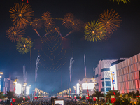 Fireworks and a drone show light up the midnight sky over Lusail Boulevard during the 2025 New Year's Day celebrations in Doha, Qatar, on Ja...