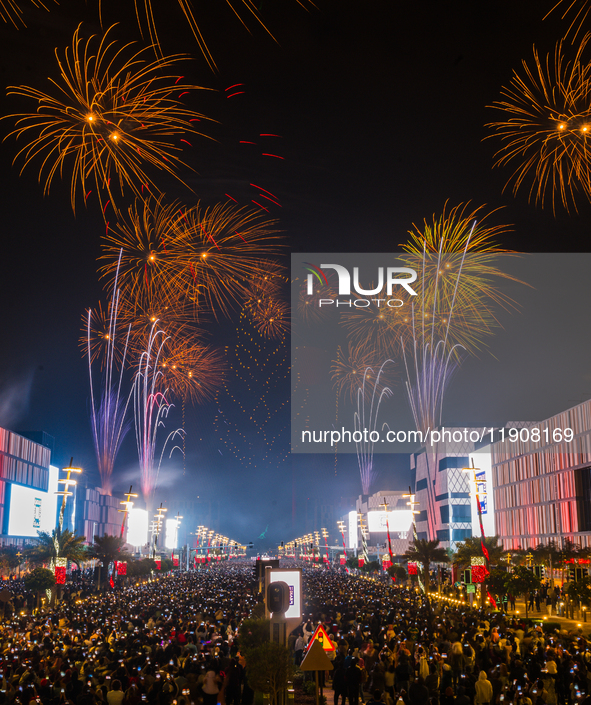 Fireworks and a drone show light up the midnight sky over Lusail Boulevard during the 2025 New Year's Day celebrations in Doha, Qatar, on Ja...