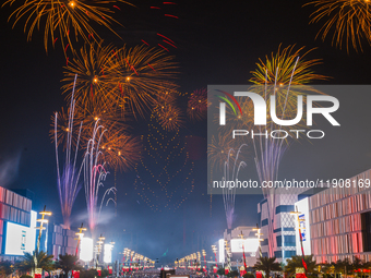 Fireworks and a drone show light up the midnight sky over Lusail Boulevard during the 2025 New Year's Day celebrations in Doha, Qatar, on Ja...