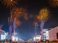 Fireworks and a drone show light up the midnight sky over Lusail Boulevard during the 2025 New Year's Day celebrations in Doha, Qatar, on Ja...