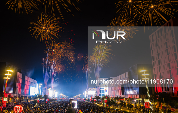 Fireworks and a drone show light up the midnight sky over Lusail Boulevard during the 2025 New Year's Day celebrations in Doha, Qatar, on Ja...