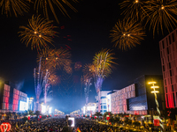 Fireworks and a drone show light up the midnight sky over Lusail Boulevard during the 2025 New Year's Day celebrations in Doha, Qatar, on Ja...