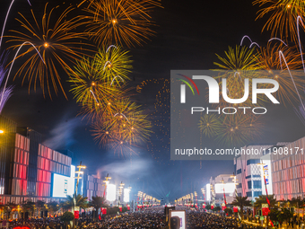 Fireworks and a drone show light up the midnight sky over Lusail Boulevard during the 2025 New Year's Day celebrations in Doha, Qatar, on Ja...