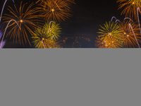 Fireworks and a drone show light up the midnight sky over Lusail Boulevard during the 2025 New Year's Day celebrations in Doha, Qatar, on Ja...